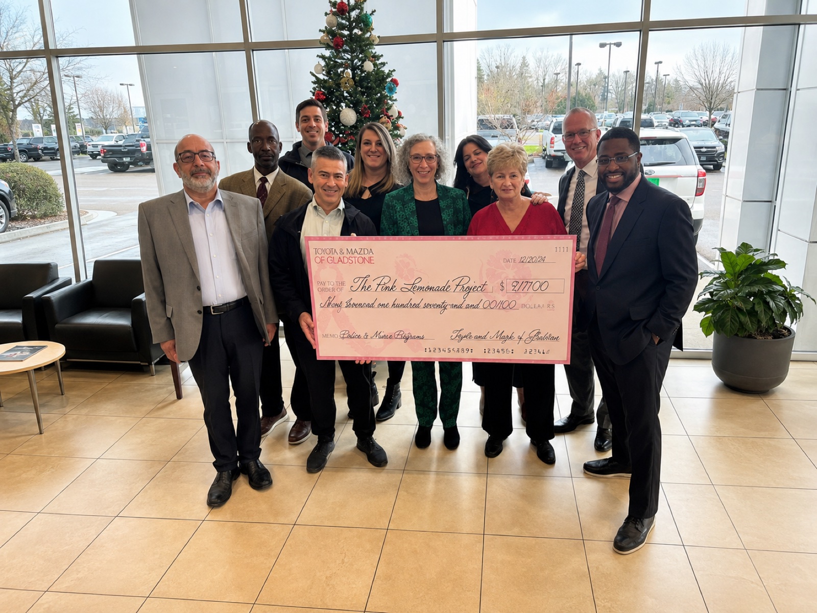 Toyota of Gladstone team presenting a donation check to the Pink Lemonade Project